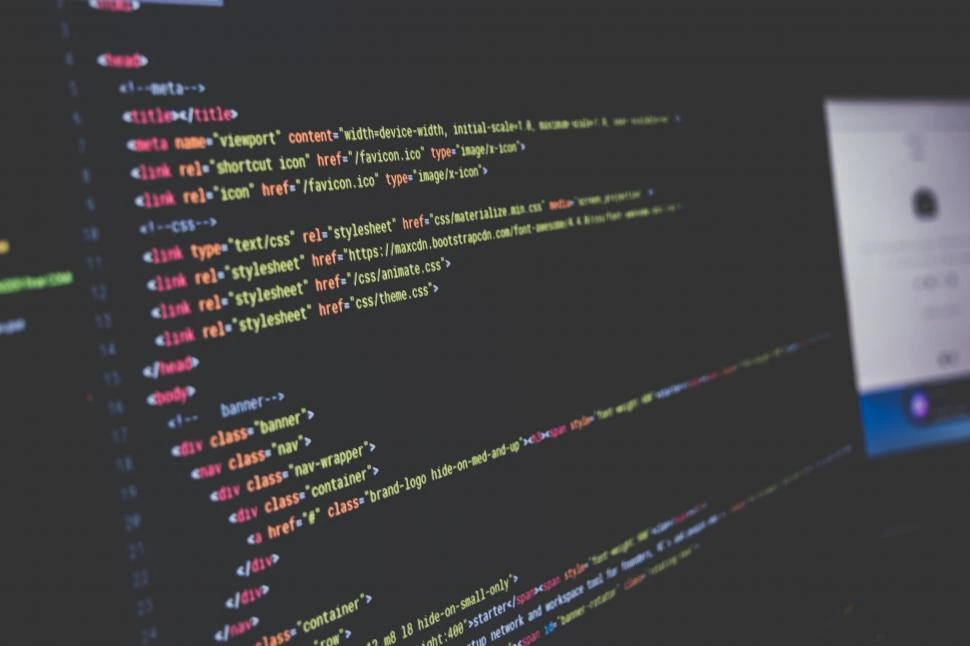 A photo of Mateusz Karoń working on code